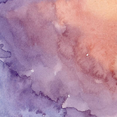 Closeup of dark purple and light pink blending watercolor paint.