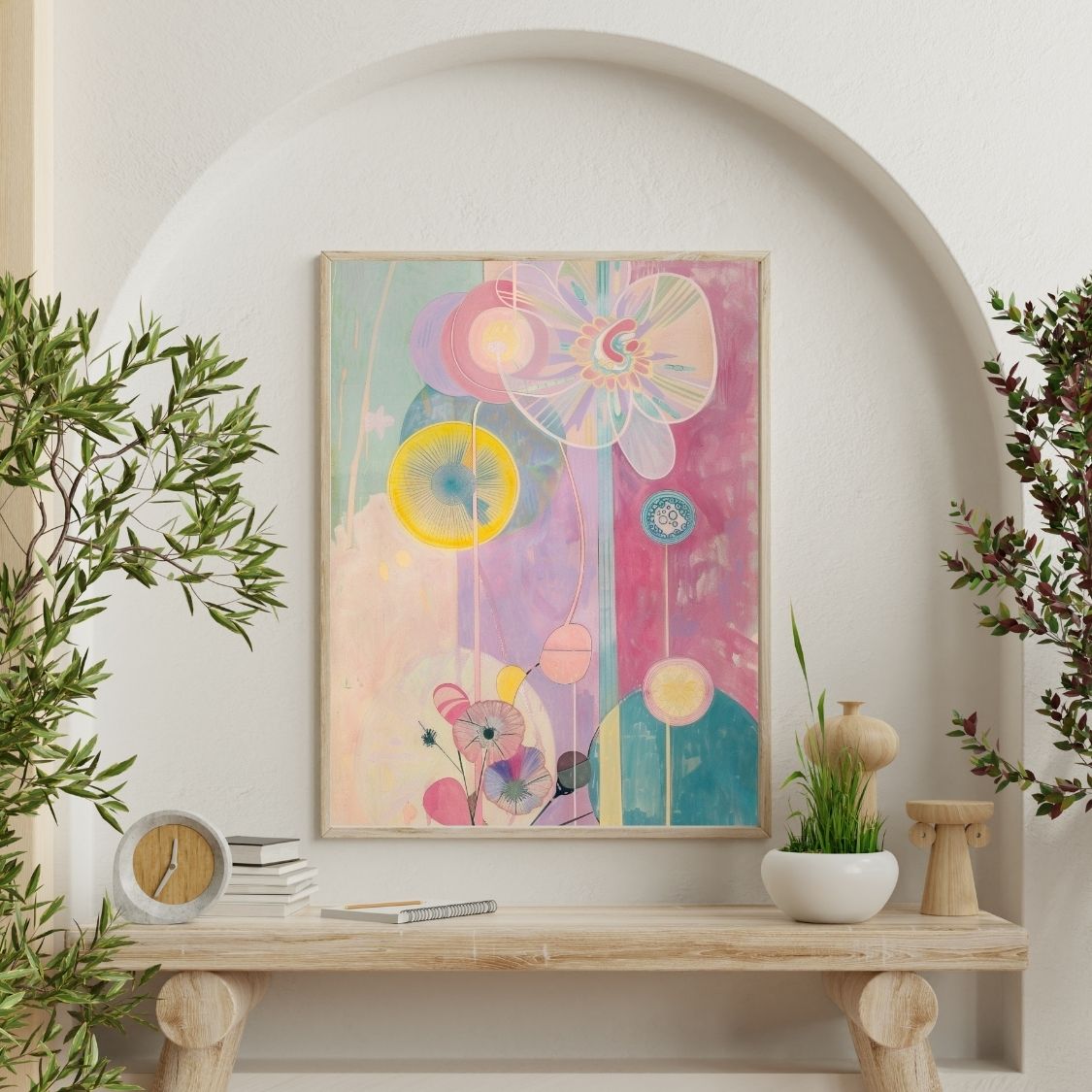 Poster wall art showing 'Blush Botanica – Abstract Flowers in Soft Pink' on a wall surrounded by plants