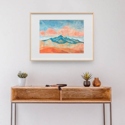 Poster wall art showing 'Clouds Over the Crest – Dramatic Mountain Pass' in a hallway