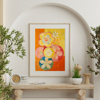 Poster wall art showing 'Vibrant Blossom Spectrum – Bold Floral Art' on a wall with plants